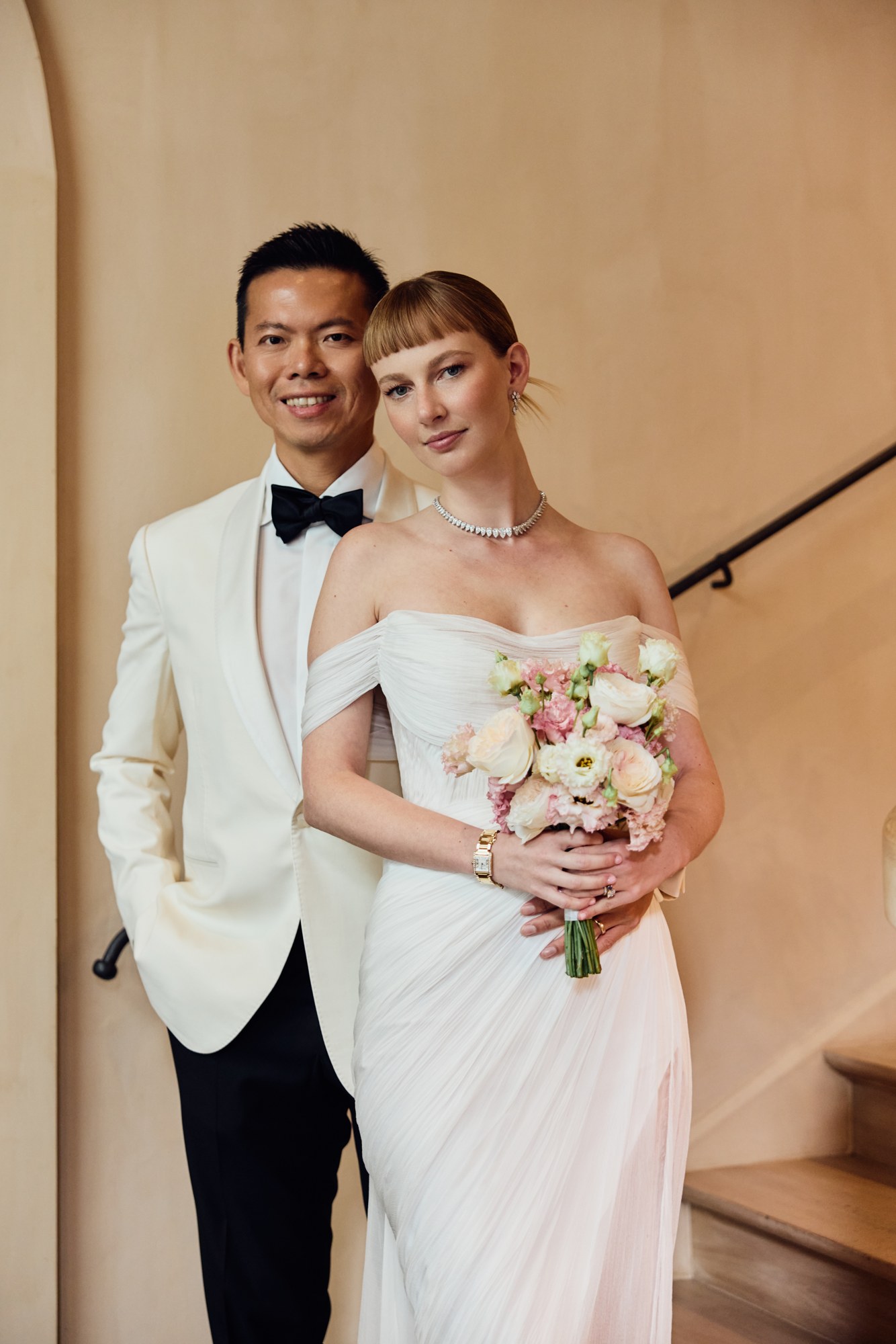 Lina and Jin with a bouquet of flowers